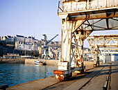 Rusty cranes at harbour. Granville. Manche. Normandy. France