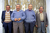 Four retired friends in small village. Lassithi plateau, Crete. Greece