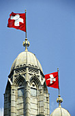 Cathedral decorated with Swiss flags. Zurich. Switzerland
