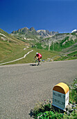 Cyclist on the famous Galibier Col route from Valloire. Savoie. France.