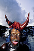 The Jab-Jabs likely lads who disguise into kind of black devils with horns and the body covered with waste motor oil.Mardi-Gras parade and preparation. Carnival. Grenada island. Caribbean