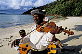 Wedding celebrated on the Achipiel Hotel beach with local musicians. Praslin Island. Seychelles