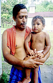 Father and son. Tahoata island. Marquesas archipelago. French Polynesia