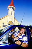 In Vaitape, family going to the sunday mass. Bora-Bora in the Leeward islands. Society archipelago. French Polynesia
