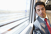 Businessman asleep. Passenger. AVE, Tren de Alta Velocidad, Zaragoza, Aragón. Spain.