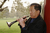 Amatuer musicians practice in Temple of Heaven park. Beijing. China