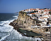 Azenhas do Mar village built on a jugged cliff and Atlantic Ocean. Estremadura. Portugal.