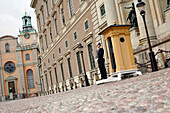 Guard in front of Royal Palace, Slottsbacken, Gamla Stan (Old Town), Stockholm, Sweden
