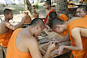 Monks doing handycrafts, Luang Prabang. Laos