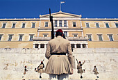 Soldiers ( evzones ) on guard at the Monument to the Unknown Soldier and Parliament (Royal Palace), Syntagma Square, Athens. Greece