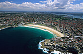 Aerial photo of Bondi Beach, subburbs to City, harbour on the right hand side, Sydney, New South Wales, Australia