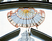 Sundial at the facade of church. Lechfeld. Swabia-Bavaria. Germany