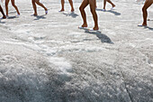 Barefeet on a glacier, a group of naked people, around 600 people are posing for Spencer Tunick and Greenpeace on the Aletsch Glacier to protest about climate change, Aletsch Glacier, Valais, Switzerland