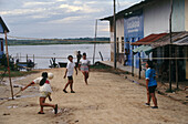 Girls playing volleyball. Amazonia. Peru