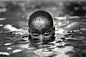 Boy swimming in Moshi, Tanzania