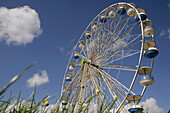 Bigwheel of fair with meadow in front. Weterpark Kermis. Amsterdam. Holland.
