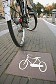 Bike sign on ground and bike, bike path, Amsterdam, Holland, Netherlands.