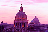 Domes of St. Peter s basilica and St. Carlo al Corso church. Rome. Italy