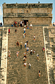 Tourists climbing The Castle (Pyramid of Kukulcan). Chichén Itzá. Mexico
