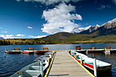 Rental boats at Pyramid Lake and Pyramid Mountain (2762 m) in background. Jasper National Park. Alberta, Canada