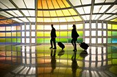 O Hare International Airport, commuters in passageway at United Airlines terminal. Chicago. Illinois, USA