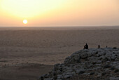 Man watching the sunset, Sahara Desert Tour, Bebel Tembain area, Sahara, Tunisia, Africa, mr
