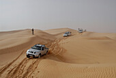 4x4 vehicle, jeep driving over sand dunes in the desert, Offroad 4x4 Sahara Desert Tour, Bebel Tembain area, Sahara, Tunisia, Africa, mr