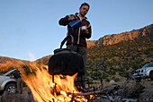 Making coffee on a camp fire, Landscape between Kozluca and Tashan, Highlands of Zamanti, Taurus Mountains, Turkey, Europe