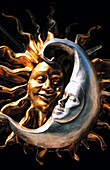 Carnival masks representing moon and sun. Venice. Italy