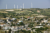 Central Iraklio Town and modern windmills. Ano Moulia. Iraklio Province. Crete. Greece