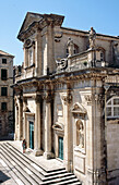 Tourists on the steps of the cathedral, Dubrovnik old town. Dalmatian coast, Croatia