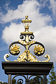 UK, London. Kensington Palace. Gilded detail on wrought iron fence