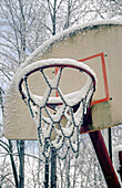 Snow on outdoor basketball hoop, Indiana, USA