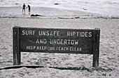 Surf Unsafe Riptides sign on beach, Carmel, California, USA