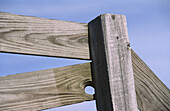 closeup of wooden fence against soft blue sky, rural Indiana, USA