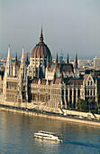Hungary, Budapest, Danube, Pleasure steamer, picture from Buda toward Pest. Government s House, Parliament.