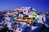 Greece, Cyclades Islands, Santorini. Ville of Oia. terraces at sunset.