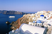 Greece, Cyclades Islands, Santorini. Vlilage of Oia. Cruise ship passing by.