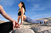 Women practicing yoga at Snow Canyon State Park. Utah, USA