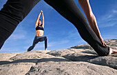 Practicing yoga at Snow Canyon State Park. Utah, USA