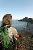 Hiking. Sea of Cortez coast, below Sierra de la Giganta Mtns. Baja California Sur. Mexico.