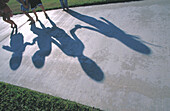 Kids shadows on walking path