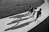 Kids walking down path together