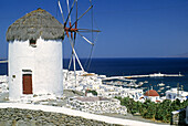 Windmill and harbour. Mykonos. Cyclades, Greece