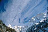 Sacred Peak Kumbhakrama. Jannu North face (7210m) and fast moving cirrus clouds. Kangchenjunga. East Nepal