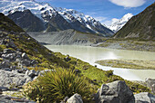 Terminal moraine and lake at the end of the Mueller Glacier, Mt Cook beyond, Mt Cook National Park, New Zealand