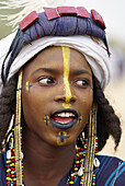 Niger. A Wodaabe-Bororo man with his face painted for the annual Gerewol male beauty contest...