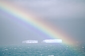 Rainbow and icebergs. Weddell Sea, Antarctica