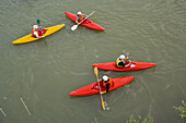 kayakers in the Adige River, Verona, Italy