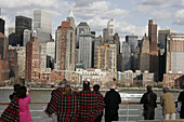 Passengers, skyline, Battery Park. Holland America Line, MS Noordam. Hudson River. Manhattan. New York. USA.